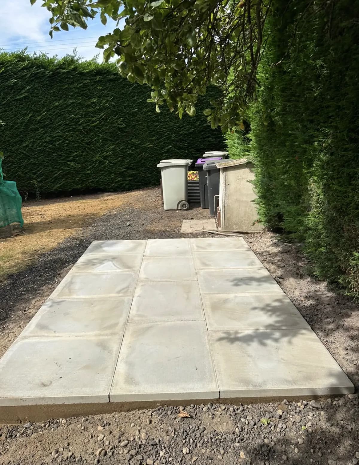 New paving-slab foundation prepared in a garden for an oil tank installation