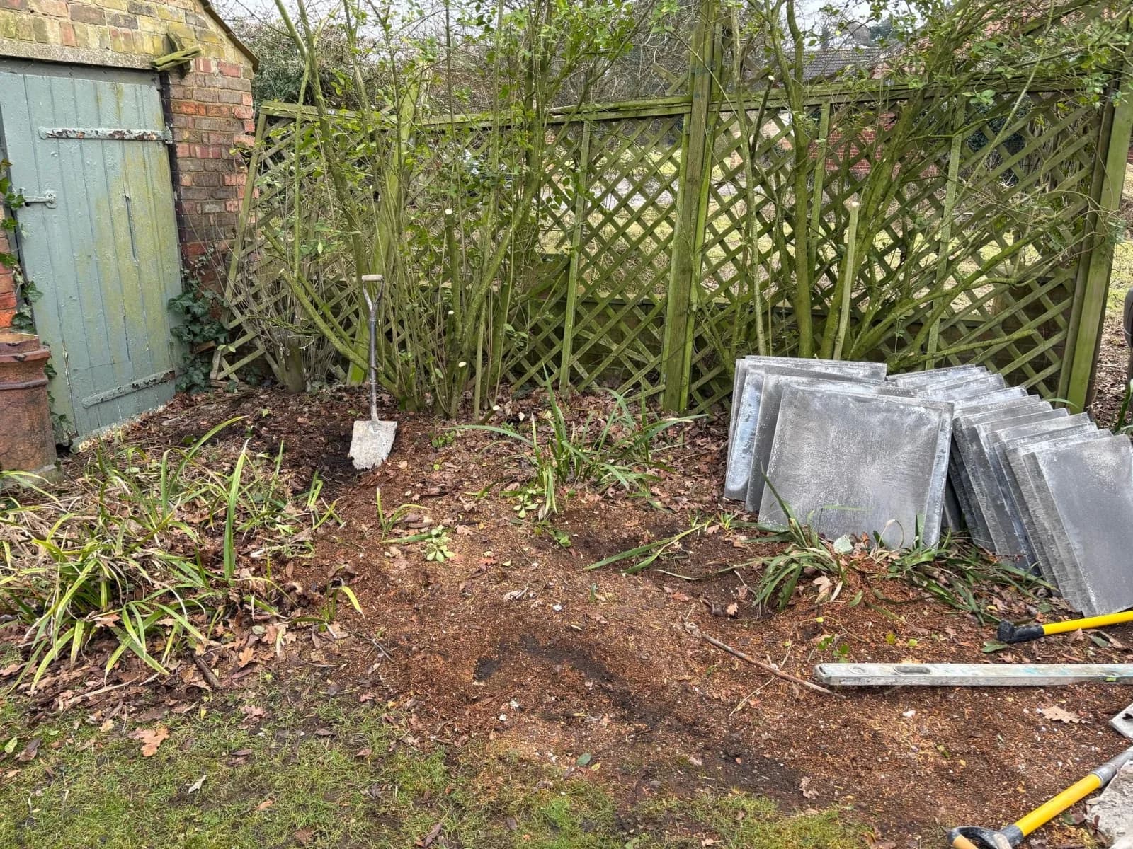 Garden site cleared and marked out for a new raised oil tank installation